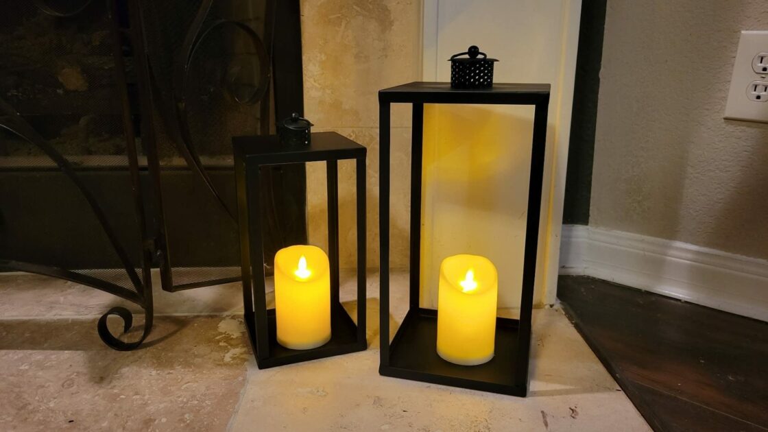black lamp warm LEdcandles closeup fireplace angle view floor candle holders