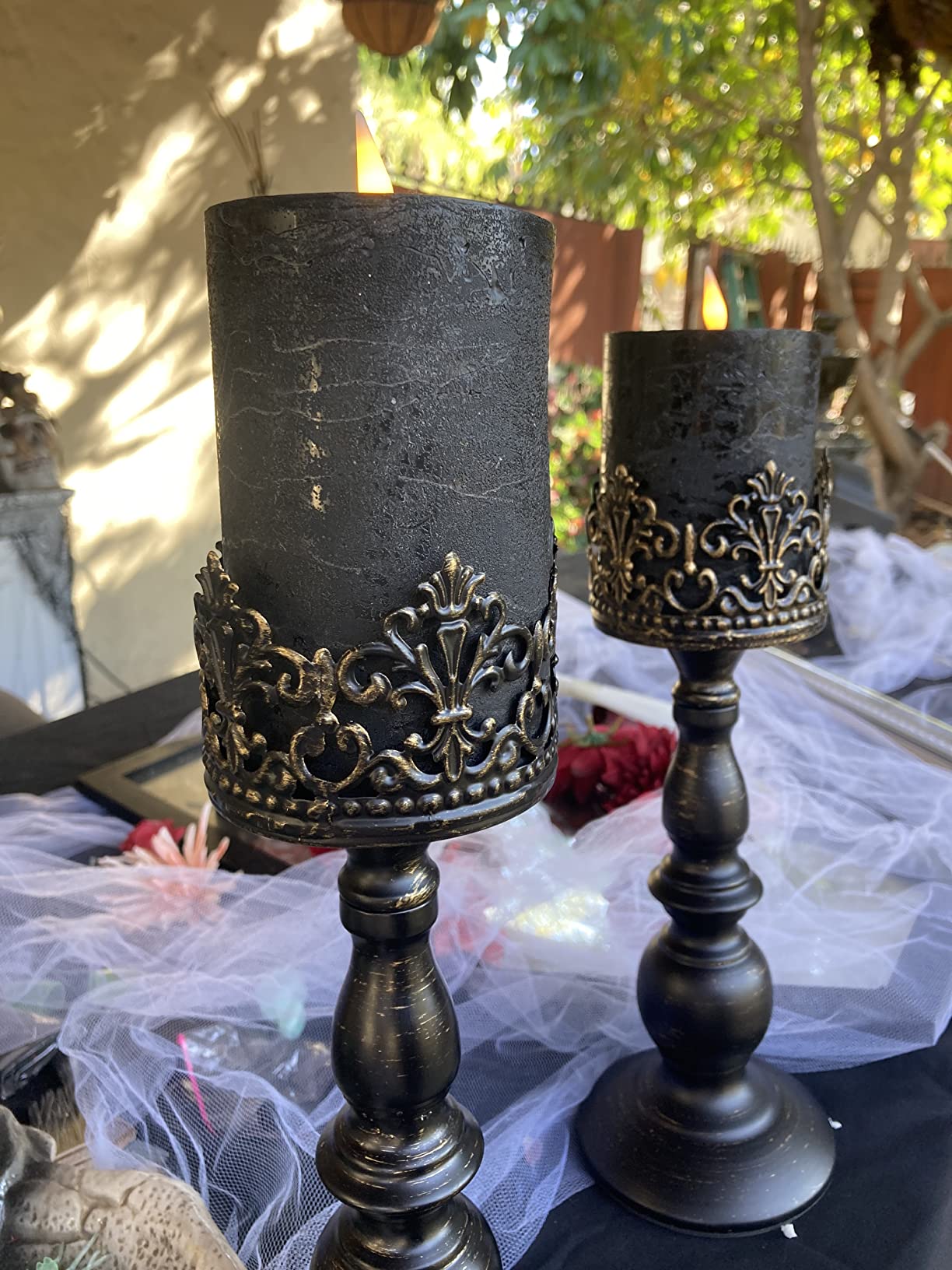 black stand closeup black candles trees outdoor gothic candle holders
