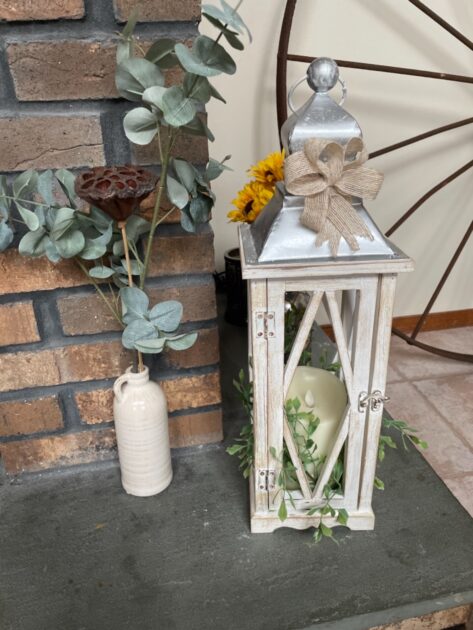 white lamp closeup top angle view bricks floor candle holders