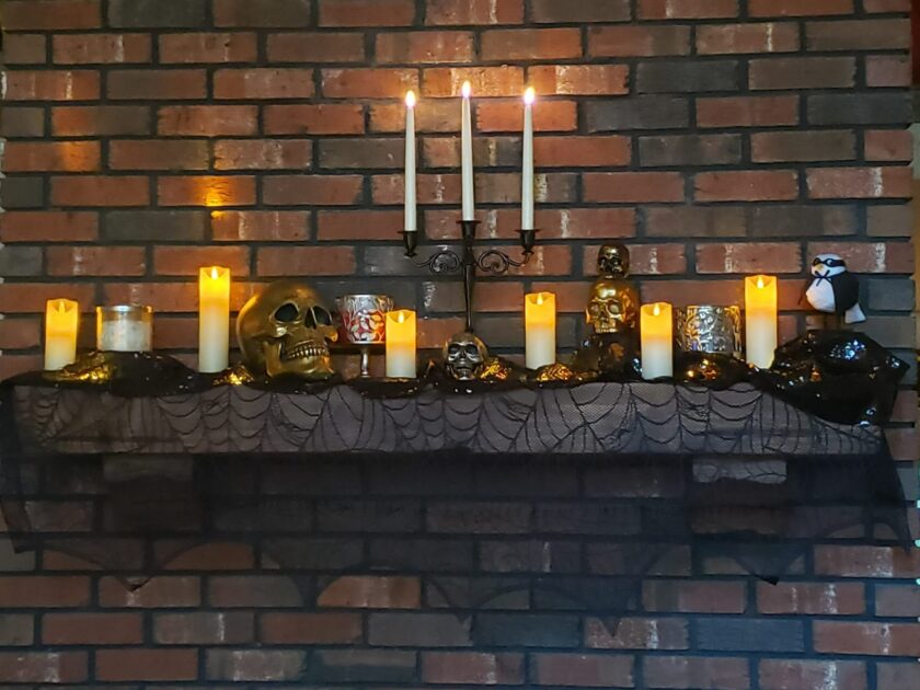black candelabra metal gold skull brick wall victorian gothic candle holder