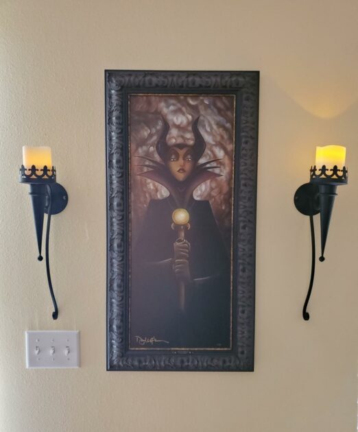 black metal wall mounted warm LEdcandles portrait medieval candle holder