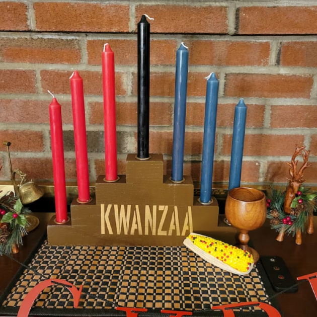 brown wooden brick wall wooden cup kwanzaa candle holders