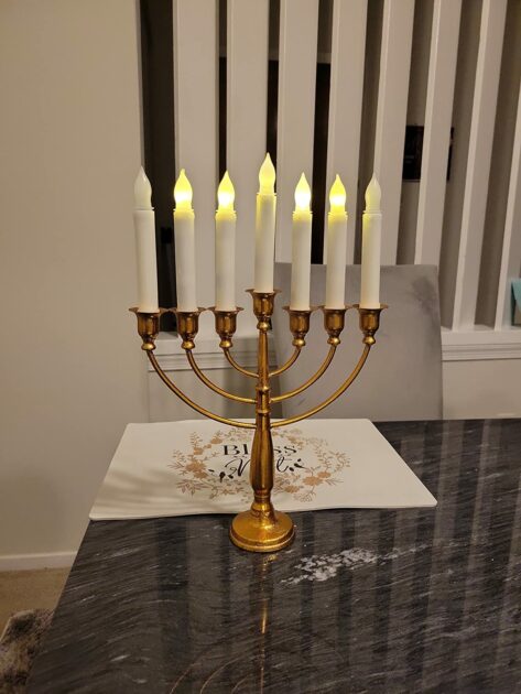 gold warm LEDcandles abgle view grey marble menorah candle holders