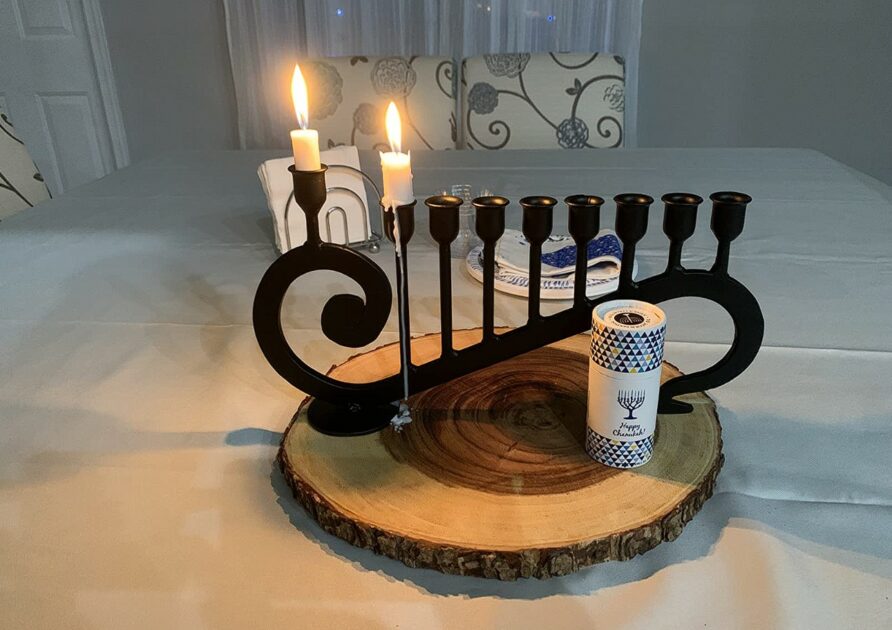 hanukkah candle holders black painted iron candle stand on wood slab