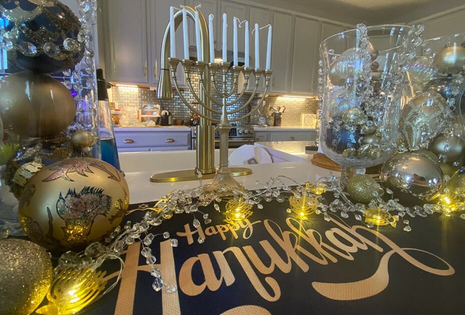 hanukkah candle holders shiny metallic gold on kitchen counter table