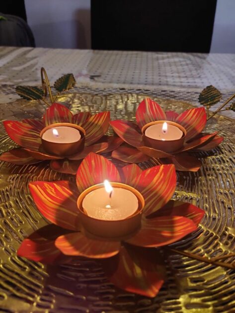 lotus candle holder red metal with yellow accent stripes