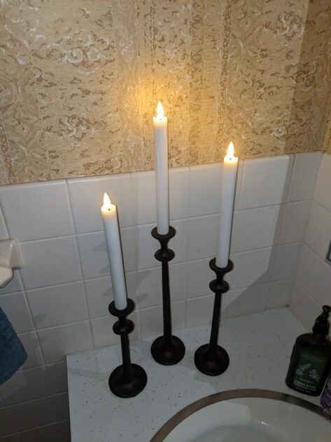 black candlesticks LED sink closeup top view candle holders in the bathroom