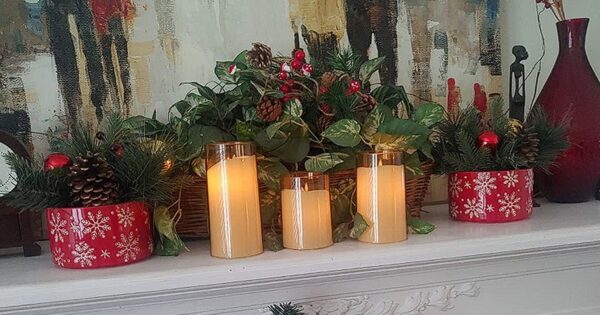 flameless candles centerpiece on top of fire place christmas decoration