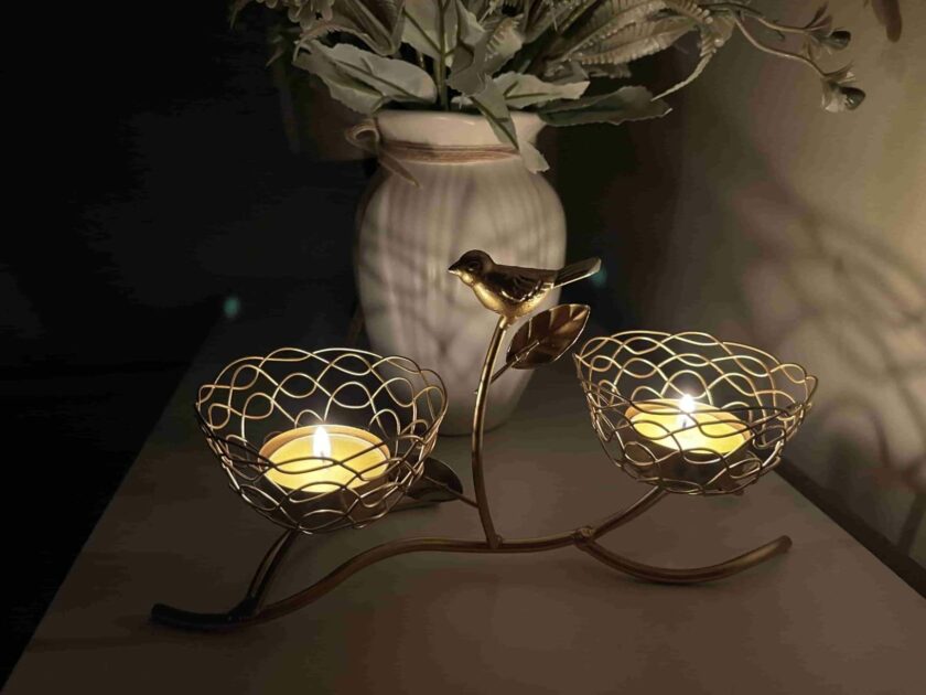 gold brid nest metal white vase closeup angle view exotic candle holders